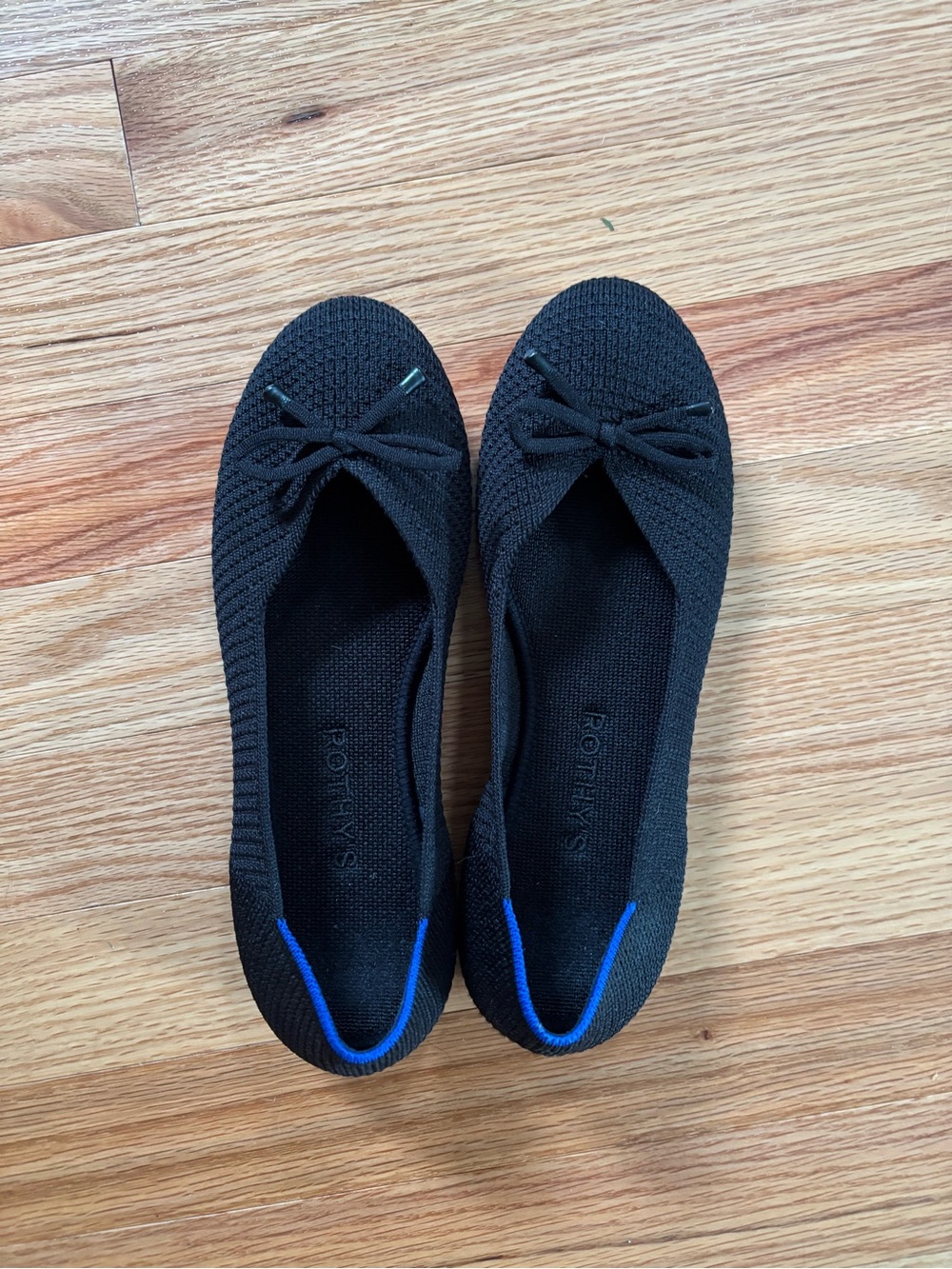 Rothy's Black Knit Ballet Flats with Blue Heel Accent